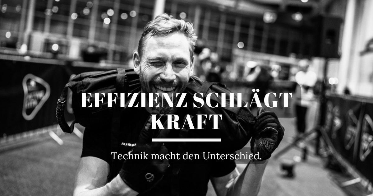 Zwei HYROX-Athleten übergeben sich den Sandbag während des Double-Men-Wettkampfs.